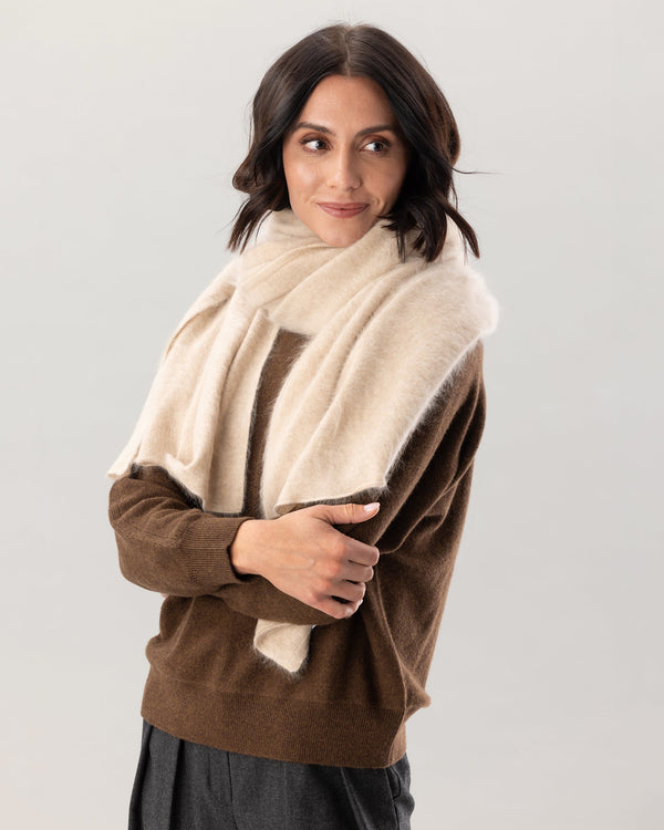 model wearing brushed cashmere scarf and hat in latte