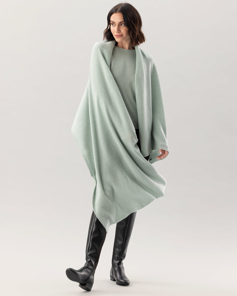 Woman wearing Kennedy Travel wrap in Sage