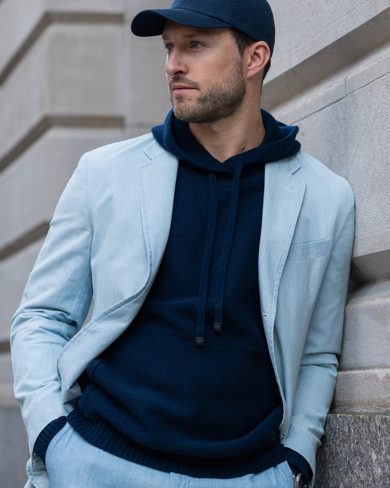 man wearing Kobre Cashmere Hoodie in Midnight