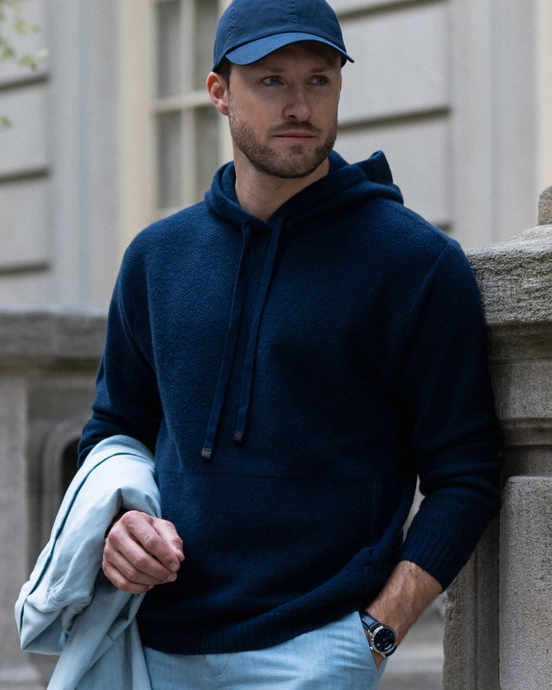 man wearing Kobre Cashmere Hoodie in Midnight