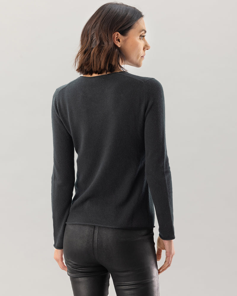 Woman wearing Nomad Sweater in Black