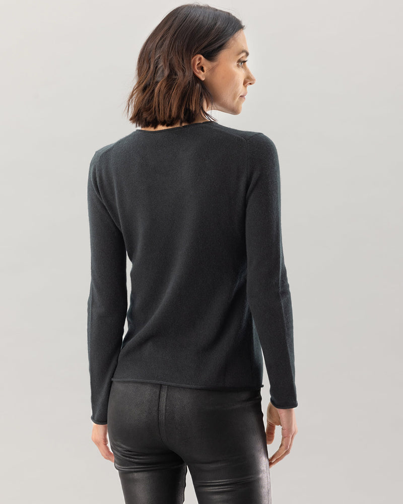 woman wearing n9omad sweater in black