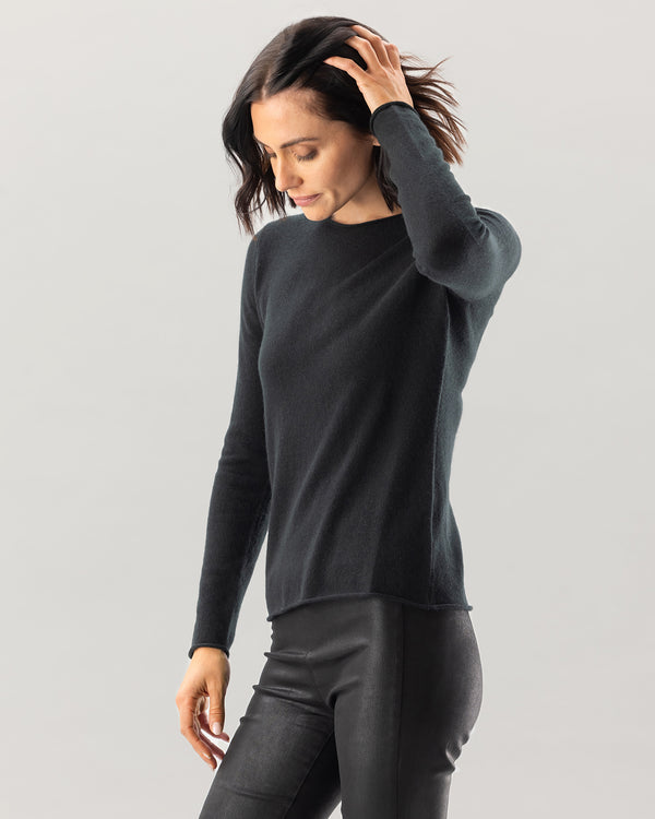 Woman wearing Nomad Sweater in Black