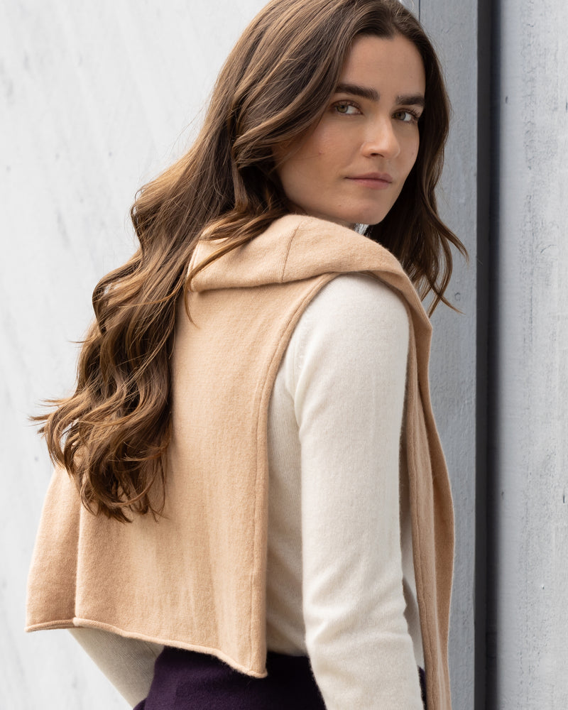 woman wearing Nomad Sweater over her shoulder in tan and crewneck in Ivory