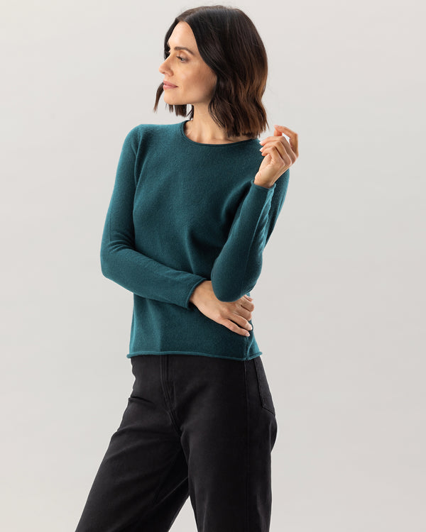 Woman wearing Nomad Sweater in Pine