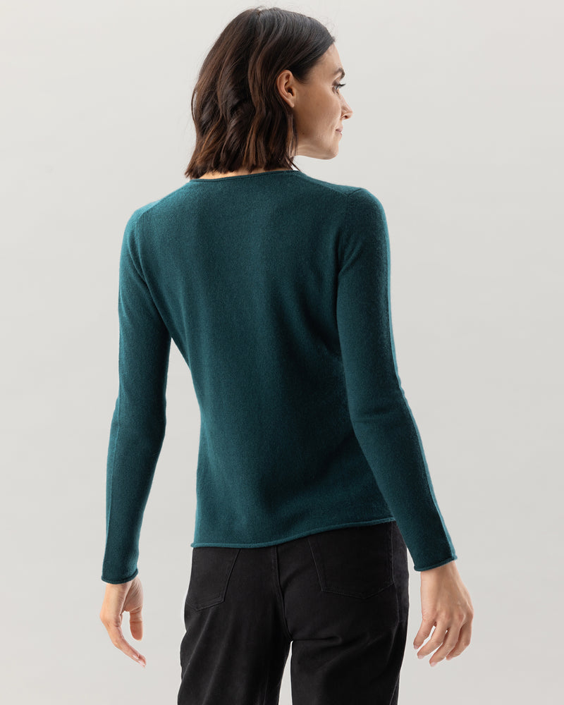 Woman wearing Nomad Sweater in Pine
