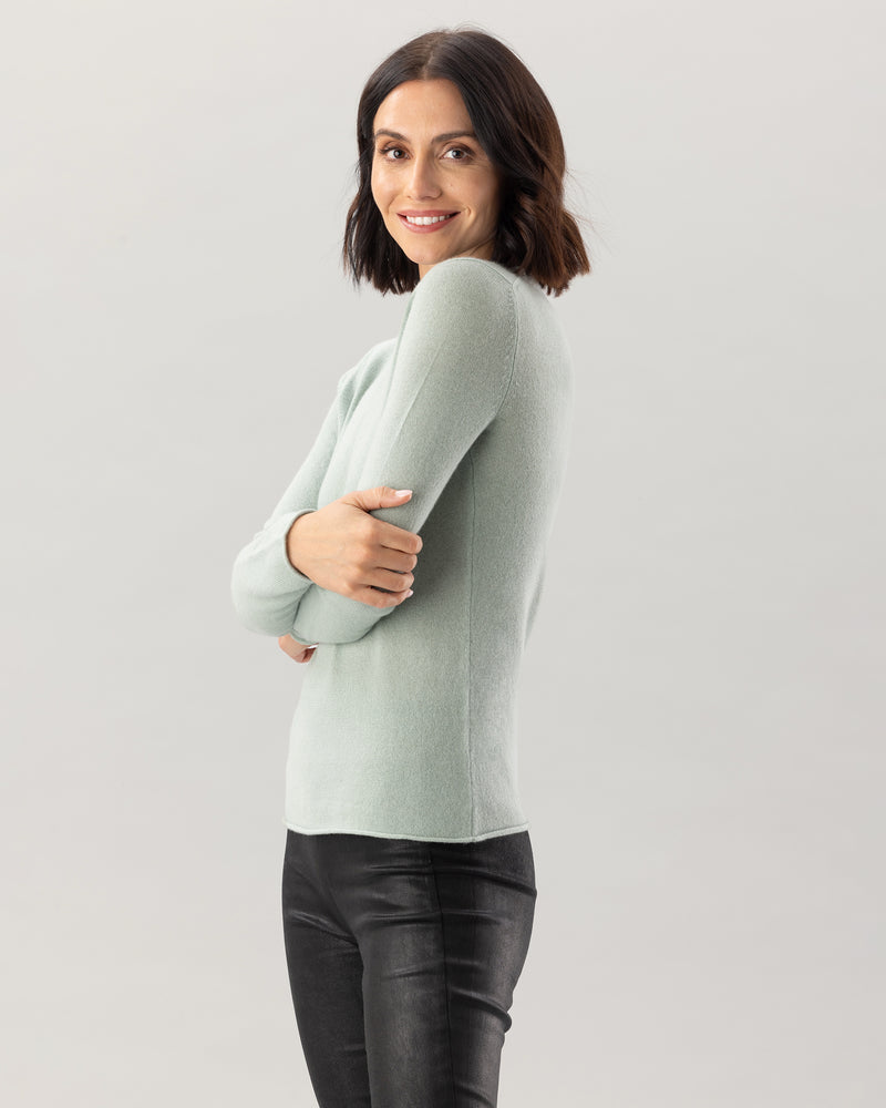Woman wearing Nomad Sweater in Sage