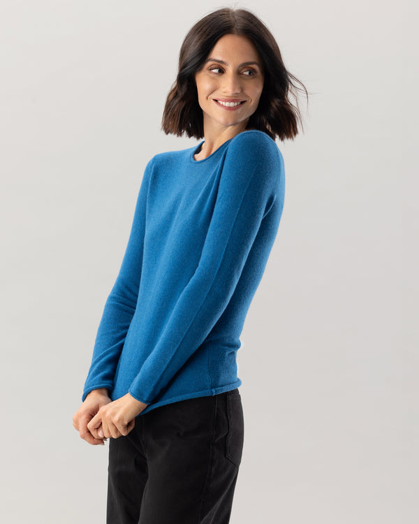 Woman wearing Nomad Sweater in Teal