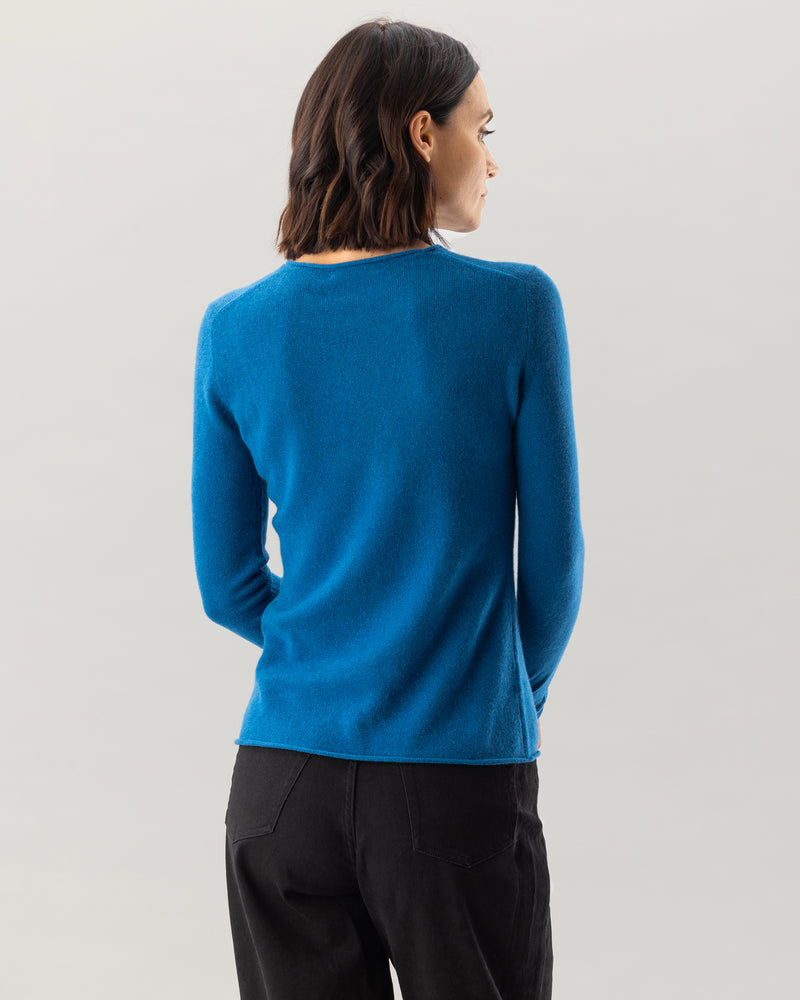Woman wearing Nomad Sweater in Teal