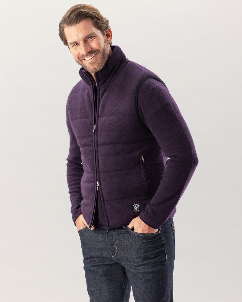 man wearing fordham quilted vest in currant