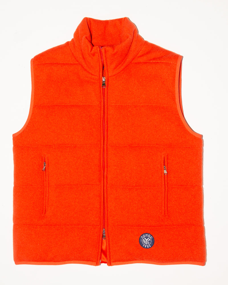 Woman wearing Magnolia Quilted Vest in Tangerine
