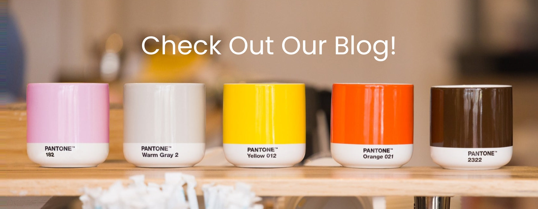 photo of Pantone cortado cups in pink, gray, yellow, orange and brown.