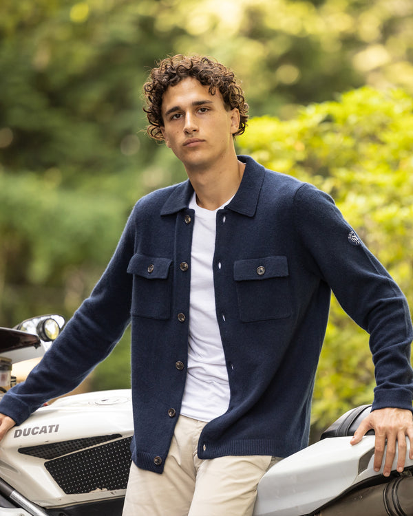 Man leaning back on motorcycle wearing Bruckner Shirt Jacket in Midnight