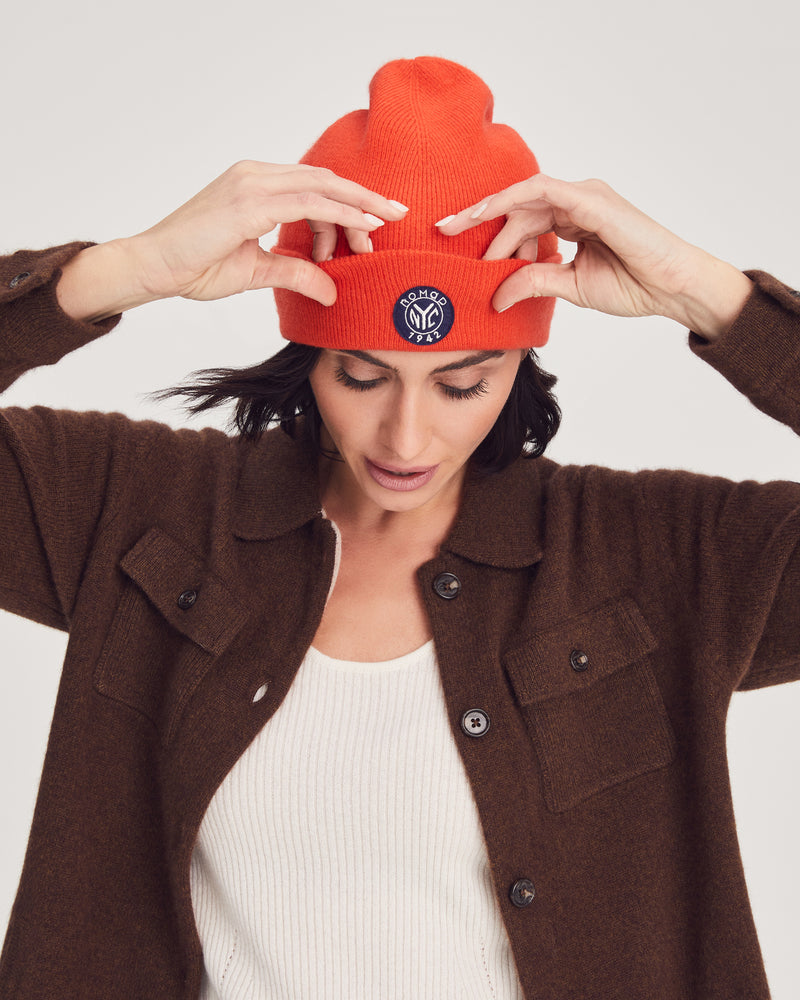 Woman wearing Summit Hat in Tangerine