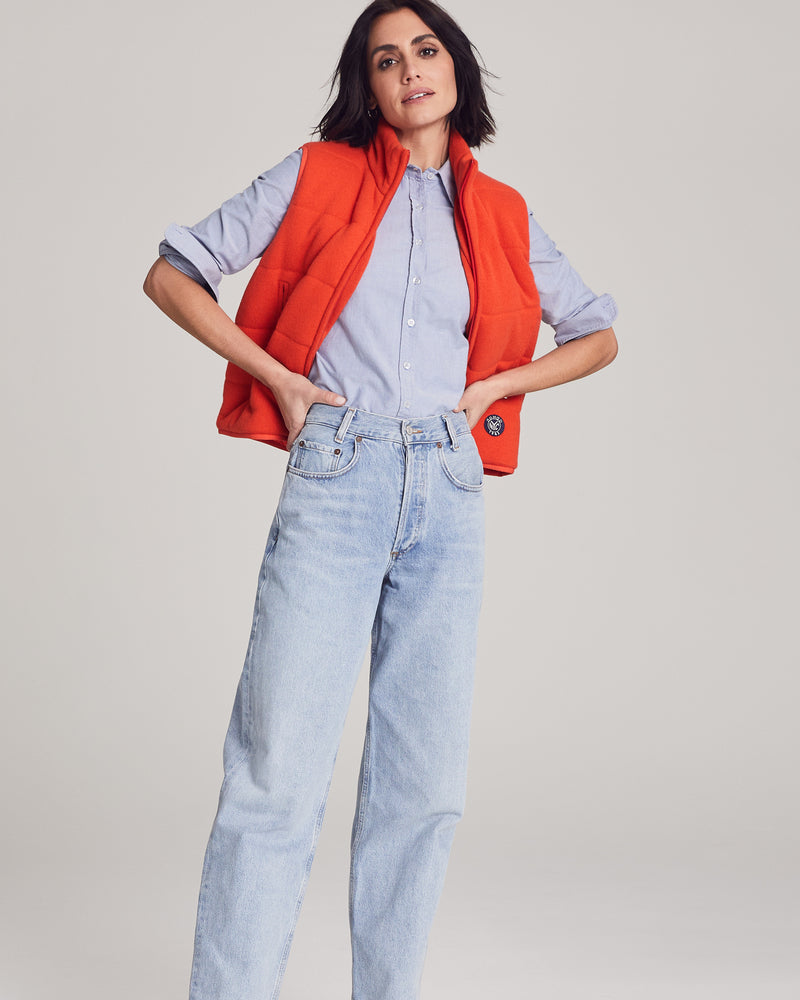 Woman wearing Magnolia Quilted Vest in Tangerine